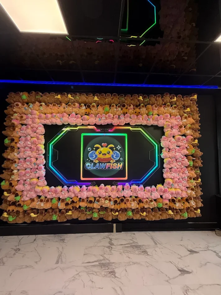 Wall of giant plush prizes at ClawFish